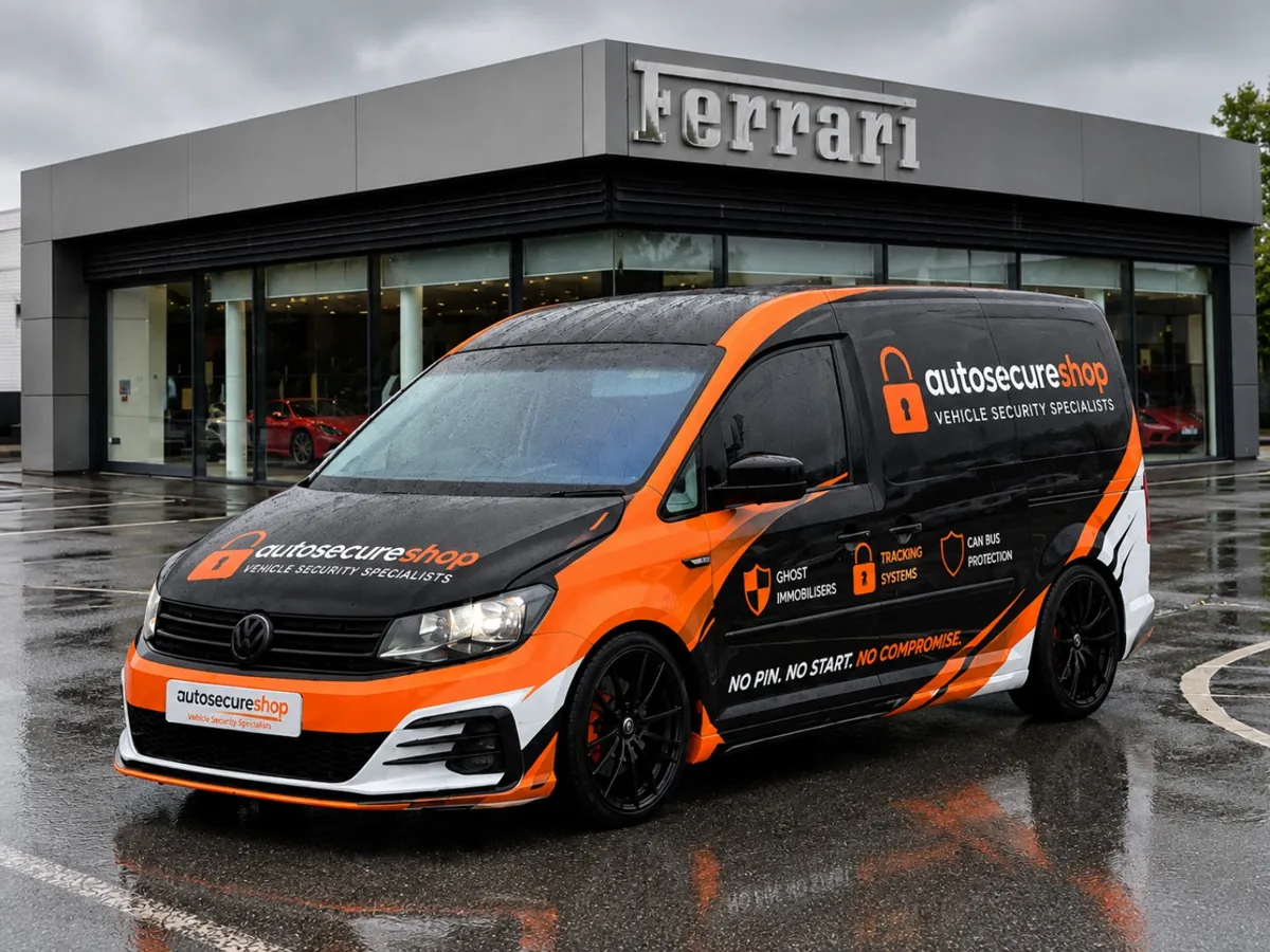Autosecureshop branded black and orange mobile installation van