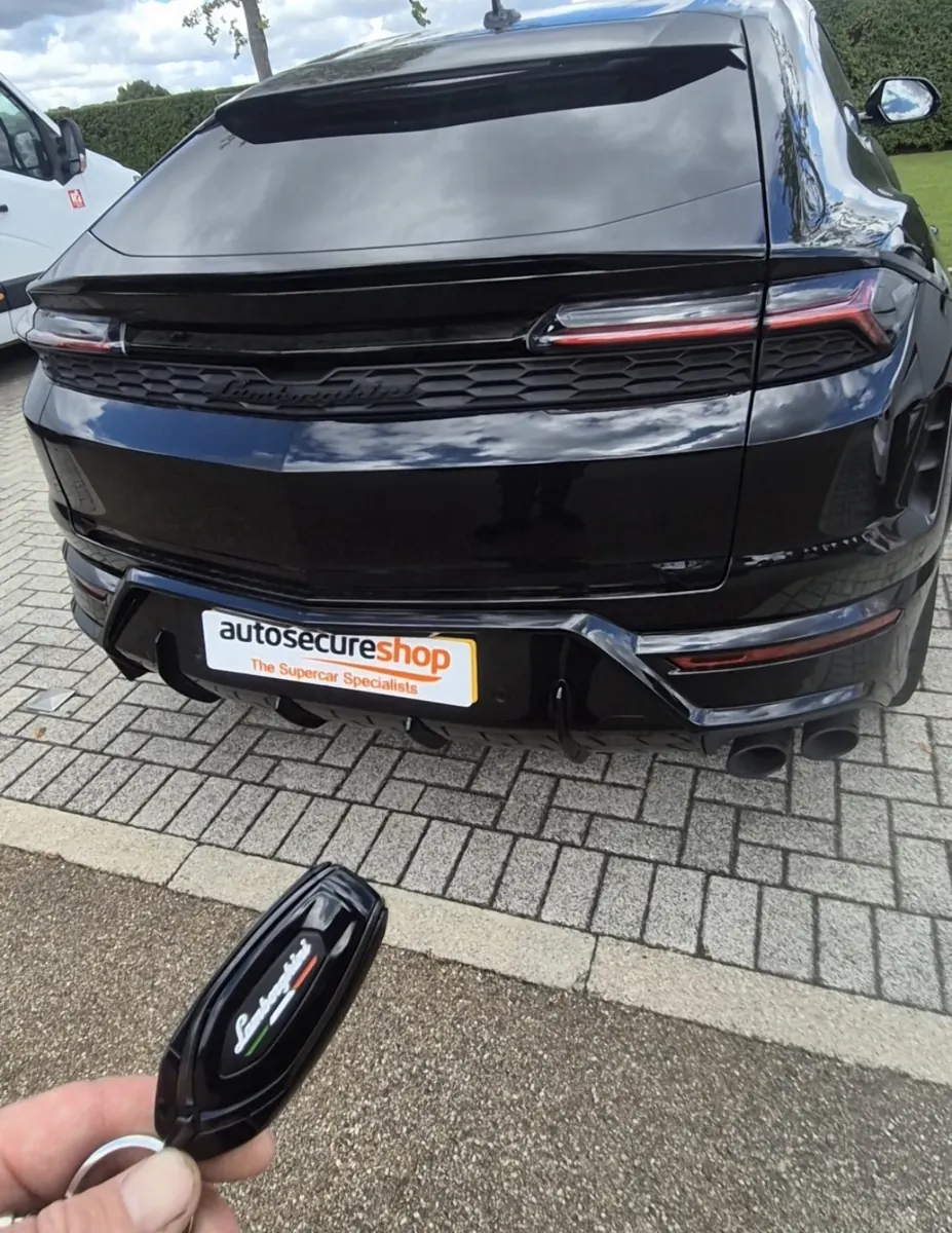 Black Lamborghini Urus one with Autosecureshop branded display plate