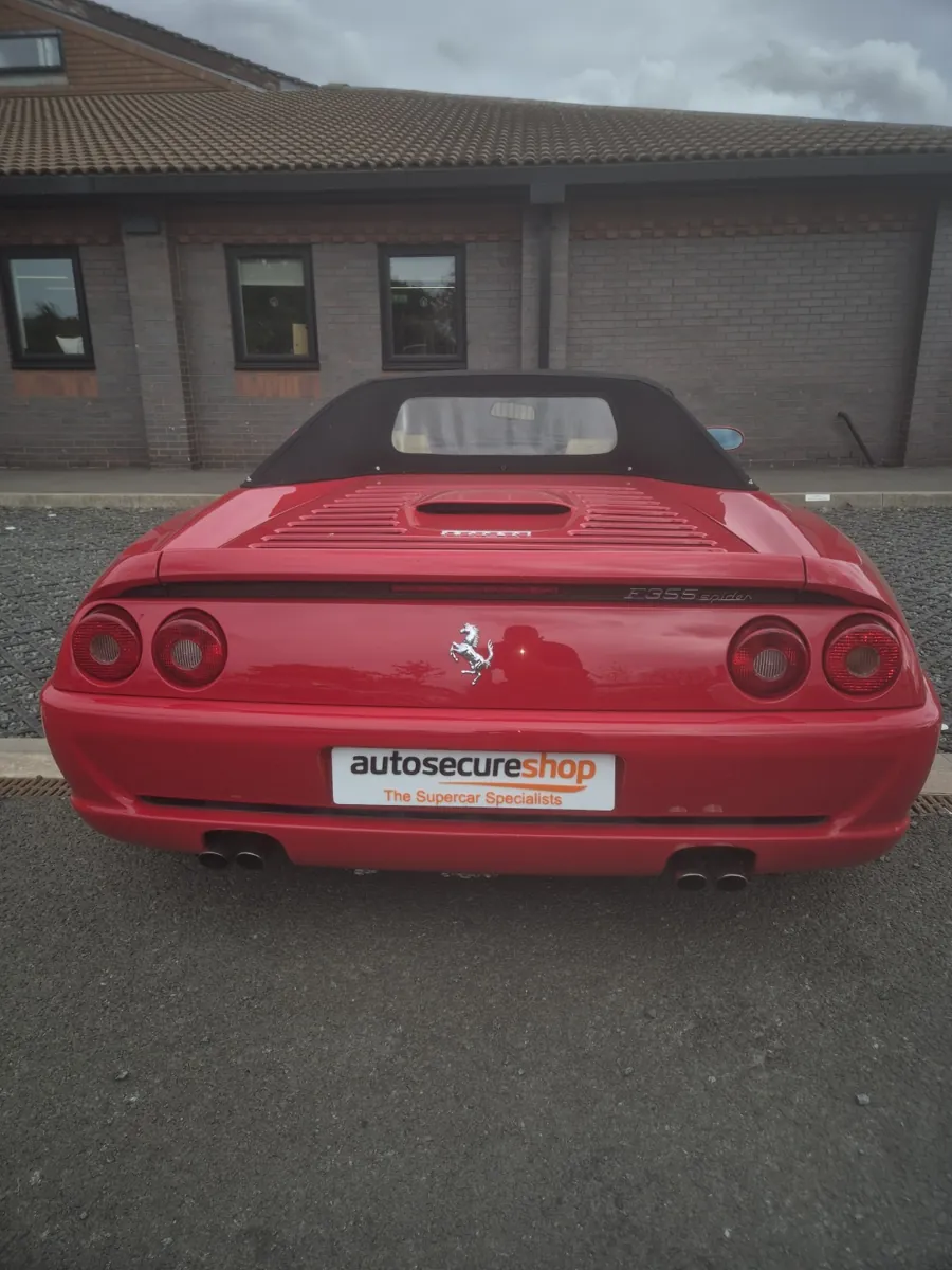 Red Ferrari F355 Spider with Autosecureshop display plate
