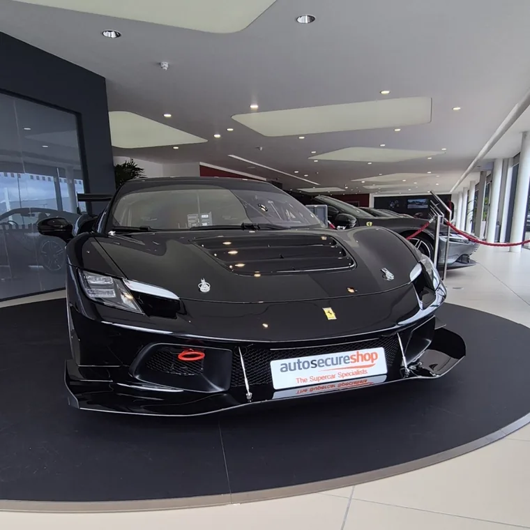 Black Ferrari in a showroom, from Autosecureshop’s installation gallery